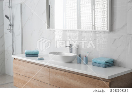 Modern mirror and vessel sink in stylish bathroom Modern mirror and vessel sink in stylish bathroom 89830385