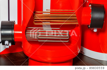 Heating elements in an industrial electric boiler in red. Heating elements in an industrial electric boiler in red. 89830559