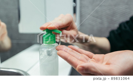 close up. man puts liquid soap on his hands . close up. man puts liquid soap on his hands . 89831064