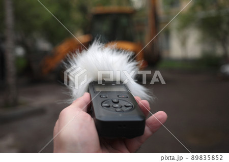 Voice recorder in hand. Voice recorder in hand. 89835852