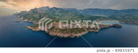 Aerial view of the luxury cliff house hotel on top of the cliff on the island of Mallorca. Aerial view of the luxury cliff house hotel on top of the cliff on the island of Mallorca. 89835975