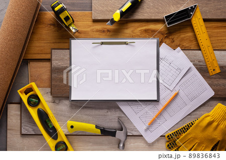 Wood laminate and tools on floor background texture. Wooden laminate top view 89836843