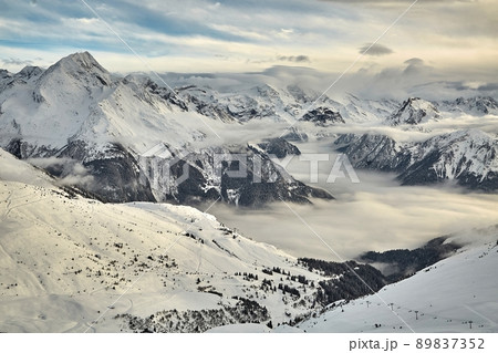 Mountain winter landscape above clouds 89837352