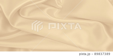 Smooth elegant golden silk or satin luxury cloth texture as wedding background. Luxurious background design. In Sepia toned. Retro style Smooth elegant golden silk or satin luxury cloth texture as wedding background. Luxurious background design. In Sepia toned. Retro style 89837389