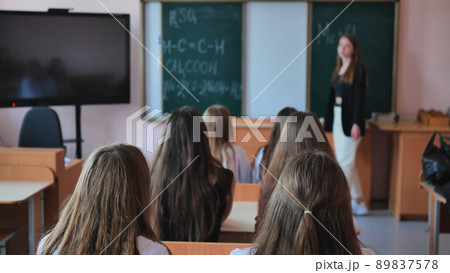 Pupils of the 11th grade in the class at the desks during the lesson. Russian school. 89837578