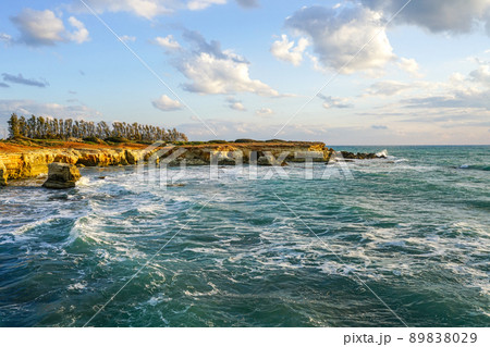 A beautiful Mediterranean bay with turquoise blue waters and a rocky coastline in Cyprus A beautiful Mediterranean bay with turquoise blue waters and a rocky coastline in Cyprus 89838029