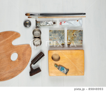 Materials for the artist, restorer on a light wooden background top view. , Materials for the artist, restorer on a light wooden background top view. , 89848993