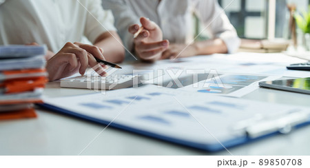 Group of Businesswoman and Accountant checking data document on digital tablet for investigation of corruption account. Anti Bribery concept. Group of Businesswoman and Accountant checking data document on digital tablet for investigation of corruption account. Anti Bribery concept. 89850708