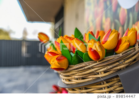 Lisse, Netherlands, April 2022. Clogs and wooden tulips, souvenirs of Holland. Lisse, Netherlands, April 2022. Clogs and wooden tulips, souvenirs of Holland. 89854447