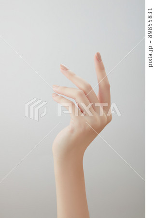 A front view of hand posing in white background for cosmetic advertising  89855831