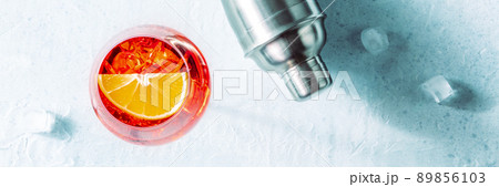 Aperol cocktail with an orange and a shaker panorama, Italian drink 89856103
