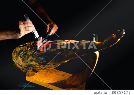 Dry Spanish ham, Jamon Serrano, Bellota, Italian Prosciutto Crudo or Parma ham. Dry Spanish ham, Jamon Serrano, Bellota, Italian Prosciutto Crudo or Parma ham. 89857175