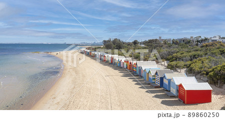 Beautiful Bathing houses on white sandy beach Beautiful Bathing houses on white sandy beach 89860250