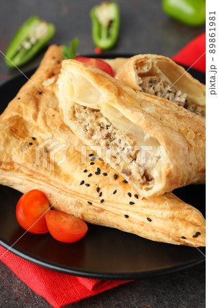 Concept of tasty food with samsa on dark textured background 89861981