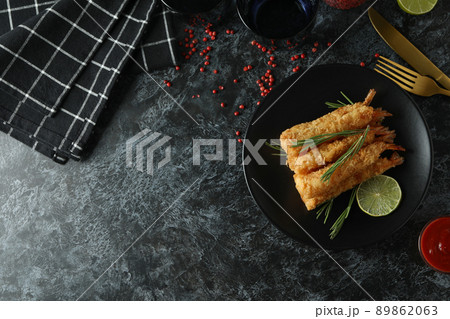 Concept of tasty food with deep-fried shrimp on dark table Concept of tasty food with deep-fried shrimp on dark table 89862063