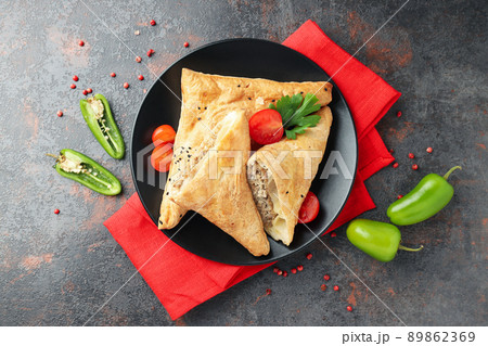 Concept of tasty food with samsa on dark textured background 89862369