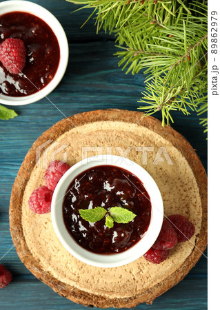 Concept of tasty food with raspberry jam on wooden background Concept of tasty food with raspberry jam on wooden background 89862979