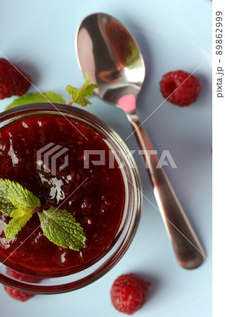 Concept of tasty food with raspberry jam on plate Concept of tasty food with raspberry jam on plate 89862999