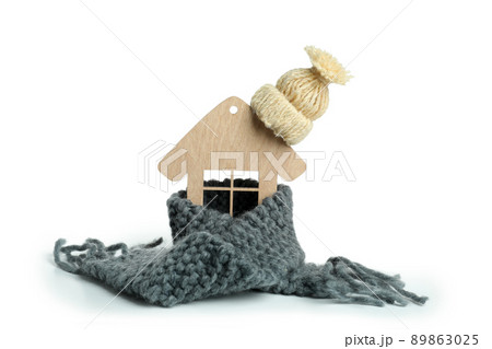 Wooden house with knitted clothes isolated on white background Wooden house with knitted clothes isolated on white background 89863025