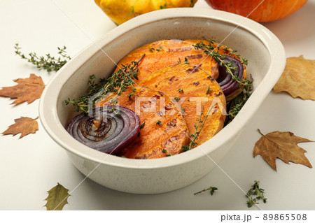 Autumn concept with baked pumpkin on white background Autumn concept with baked pumpkin on white background 89865508