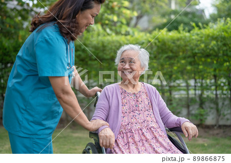Doctor caregiver help and care Asian senior or elderly old lady woman patient sitting on wheelchair at nursing hospital ward, healthy strong medical concept Doctor caregiver help and care Asian senior or elderly old lady woman patient sitting on wheelchair at nursing hospital ward, healthy strong medical concept 89866875