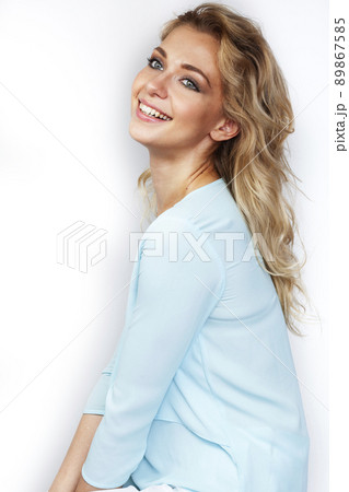 young pretty stylish blond girl posing emotional isolated on white background happy smiling cool smile, lifestyle people concept close up 89867585