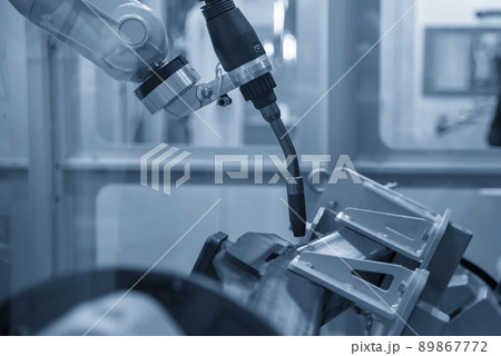 The automatic welding robot working with automotive parts assembly processing. The automatic welding robot working with automotive parts assembly processing. 89867772