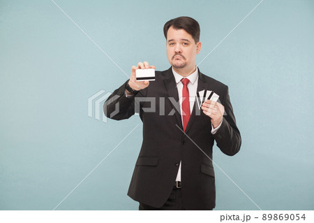 One bank card will replace all your other cards. Indoor, studio shot, isolated on light blue or gray background 89869054