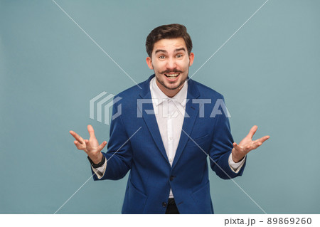 How you did this? Portrait of stressed manager in work. Business people concept, richly and success. Indoor, studio shot on light blue background 89869260