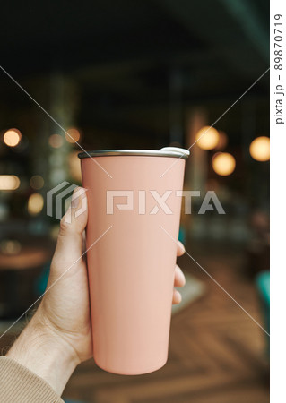 Pensive young bearded SMM manager drinking coffee and thinking about customers message while working remotely in cafe Pensive young bearded SMM manager drinking coffee and thinking about customers message while working remotely in cafe 89870719