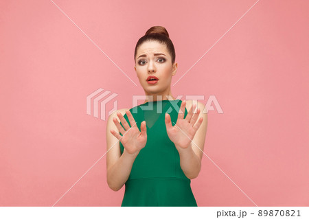 No! Fear reaction of beautiful woman . Expression emotion and feelings concept. Studio shot, isolated on pink background No! Fear reaction of beautiful woman . Expression emotion and feelings concept. Studio shot, isolated on pink background 89870821