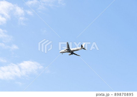 plane flying in blue sky, preparing for landing. plane flying in blue sky, preparing for landing. 89870895