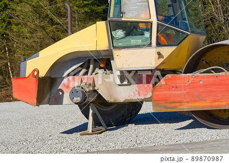 road roller with a broken wheel. Road roller compactor on highway ,these used to compact gravel, concrete or soil in road construction, 89870987