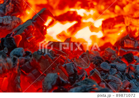 red hot coals in a blast furnace for metal melting. metal mining and processing industry. Red coals from a burnt fire made of wood red hot coals in a blast furnace for metal melting. metal mining and processing industry. Red coals from a burnt fire made of wood 89871072