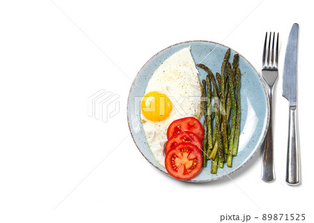 Healthy homemade breakfast with asparagus, fried egg and arugula. quarantine healthy eating concept. keto diet. 89871525