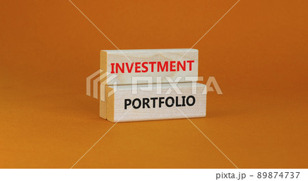 Investment portfolio symbol. Wooden blocks with concept words Investment portfolio on beautiful orange background. Business investment portfolio concept. Copy space. Investment portfolio symbol. Wooden blocks with concept words Investment portfolio on beautiful orange background. Business investment portfolio concept. Copy space. 89874737