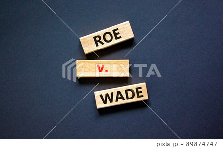 Abortion process Roe versus Wade symbol. Concept words Roe versus Wade on wooden blocks. Beautiful black table black background. Abortion process Roe versus Wade concept. Copy space. Abortion process Roe versus Wade symbol. Concept words Roe versus Wade on wooden blocks. Beautiful black table black background. Abortion process Roe versus Wade concept. Copy space. 89874747