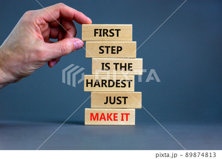 Make first step symbol. Wooden blocks with words First step is the hardest just make it. Beautiful grey table grey background. Businessman hand. Business and make first step concept. Copy space. Make first step symbol. Wooden blocks with words First step is the hardest just make it. Beautiful grey table grey background. Businessman hand. Business and make first step concept. Copy space. 89874813
