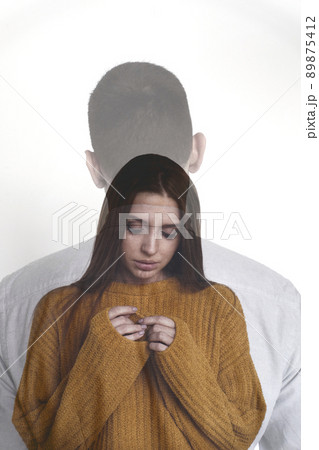 Portrait of young beautiful woman standing with her back to unrecognizable man and looking at hands sadly, double exposure Portrait of young beautiful woman standing with her back to unrecognizable man and looking at hands sadly, double exposure 89875412