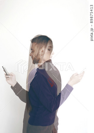 Double exposure portrait of young bearded man and attractive long-haired woman using smartphones on white background 89875413
