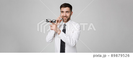 Lifestyle and Business Concept - Portrait of a handsome businessman enjoy talking with mobile phone. Isolated White background. Copy Space. 89879526