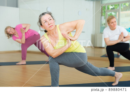 Three women are doing angle pose Three women are doing angle pose 89880471