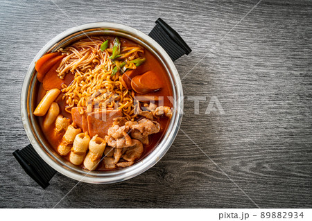 Budae Jjigae or Budaejjigae (Army stew or Army base stew). It is loaded with Kimchi, spam, sausages, ramen noodles and much more 89882934