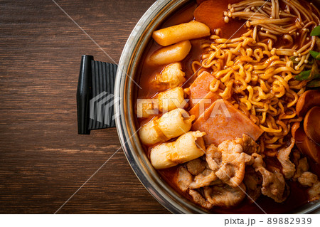 Budae Jjigae or Budaejjigae (Army stew or Army base stew). It is loaded with Kimchi, spam, sausages, ramen noodles and much more 89882939