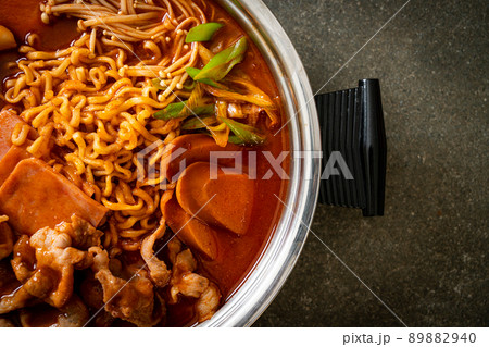 Budae Jjigae or Budaejjigae (Army stew or Army base stew). It is loaded with Kimchi, spam, sausages, ramen noodles and much more 89882940