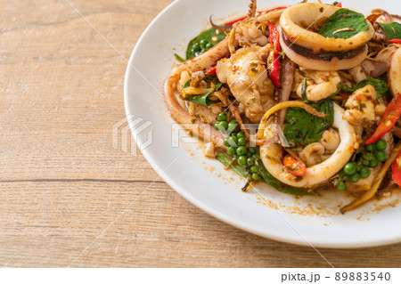 stir fried holy basil with octopus or squid and herb 89883540