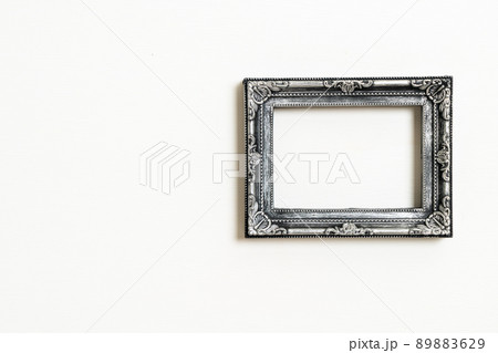 empty picture frame on white wall background 89883629
