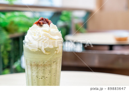 matcha green tea latte blended with whipped cream and red bean 89883647