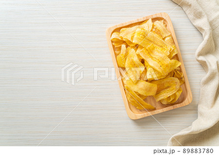 Banana Chips - fried or baked sliced banana 89883780