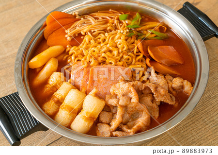 Budae Jjigae or Budaejjigae (Army stew or Army base stew). It is loaded with Kimchi, spam, sausages, ramen noodles and much more 89883973